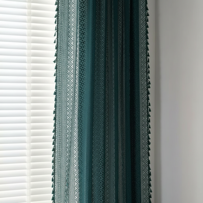 Lumine semi-sheer floral crochet-lace curtain panel in green with tassels, hung at a window