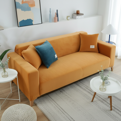 Orange velvet full stretch sofa slipcover fitted on a 3-seater couch in a bright modern living room