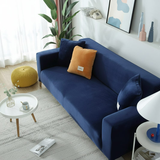 Navy blue velvet full stretch sofa slipcover fitted on a 3-seater couch in a bright modern living room