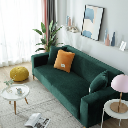 Dark Green velvet stretch sofa slipcover fully fitted in a modern living room