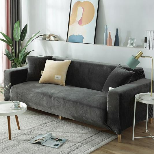 Grey velvet stretch sofa slipcover fully fitted in a modern living room