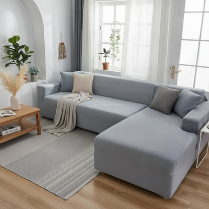 Mouse grey micro-fabric stretch slipcover fully fitted on L-shaped corner sofa in a modern living room