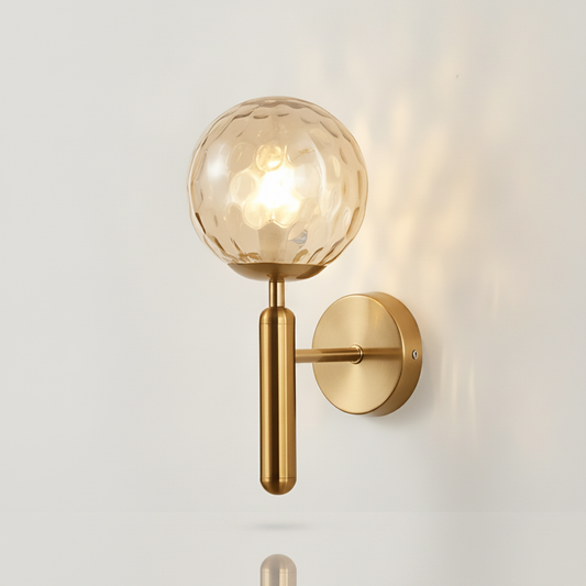 Bauer Brass Wall Light - Amber Dimple globe studio packshot
