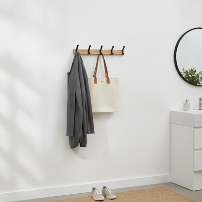 Nordic Wall Coat Rack mounted in an entryway with a coat and tote bag