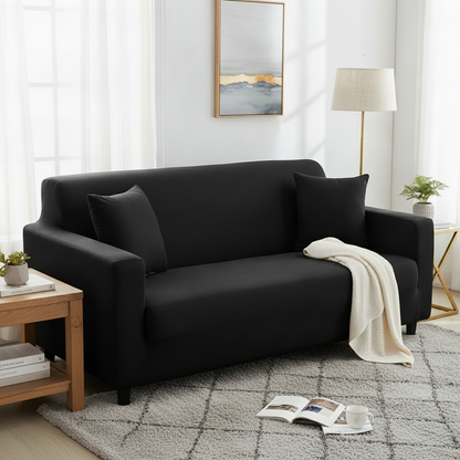 Black Adaptable Couch Cover - full slipcover styled in a modern living room