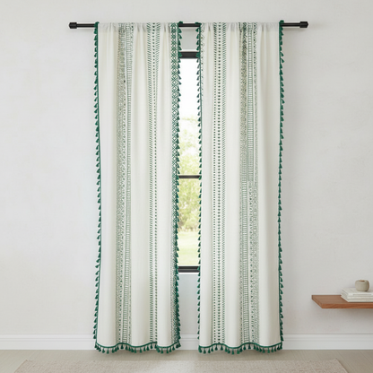 Emerald Tribe Boho Tassel Curtain hung on a window in a styled room