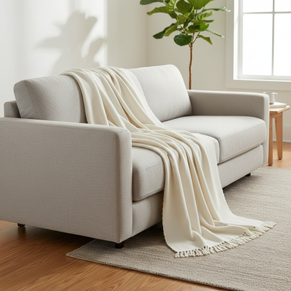 Mousoon Off-White Throw Blanket styled in a modern living room