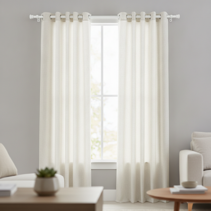 Adjustable telescopic curtain rod mounted at a window holding a curtain